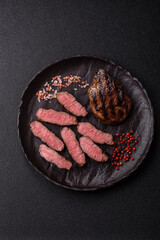 Grilled beef steak meat with salt and pepper. Beef steak grilled on a barbecue