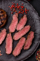 Grilled beef steak meat with salt and pepper. Beef steak grilled on a barbecue