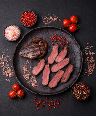 Grilled beef steak meat with salt and pepper. Beef steak grilled on a barbecue