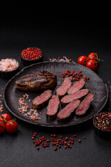 Grilled beef steak meat with salt and pepper. Beef steak grilled on a barbecue