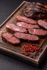 Grilled beef steak meat with salt and pepper. Beef steak grilled on a barbecue