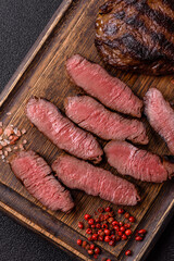 Grilled beef steak meat with salt and pepper. Beef steak grilled on a barbecue