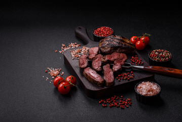 Grilled beef steak meat with salt and pepper. Beef steak grilled on a barbecue