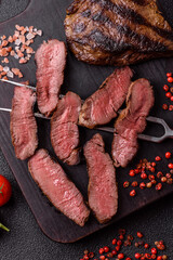 Grilled beef steak meat with salt and pepper. Beef steak grilled on a barbecue