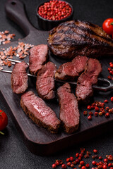 Grilled beef steak meat with salt and pepper. Beef steak grilled on a barbecue