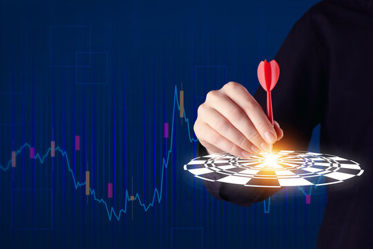 Targeting. Business woman touching aim with arrow on virtual screen against dark blue background, closeup - Powered by Adobe