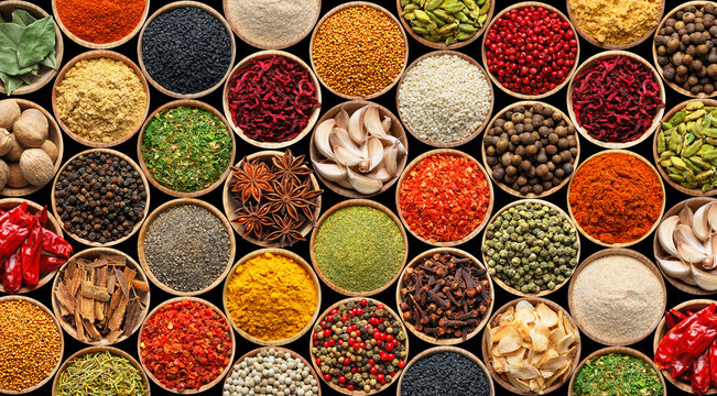 Set of different aromatic spices in bowls on black background, flat lay. Banner design