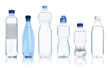 Plastic bottles with water on white background, set