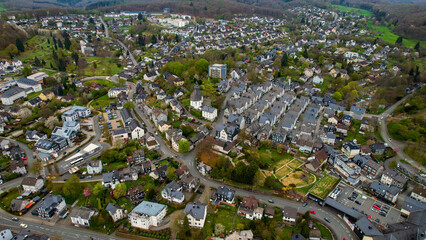 A panoramic aerial view around the old town in the city Freudenberg, Germany on a cloudy spring day