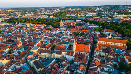 Regensburg at sunset captured from above, featuring the iconic Stone Bridge over the Danube River...