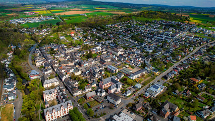 A panoramic aerial view around the old town in the city Hadamar, Germany on a cloudy spring day
