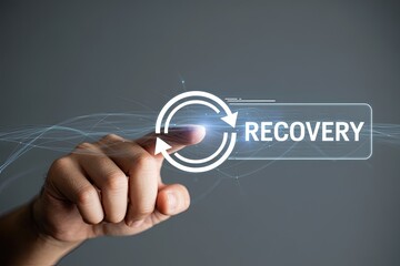Human finger touching a glowing digital button with the word recovery and a circular arrow symbolizing renewal and progress
