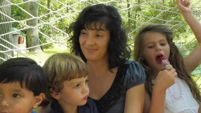 Close up of mixed family eating popsicles 