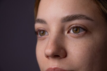 Close-up portrait of a woman after eyelash lamination procedure. 