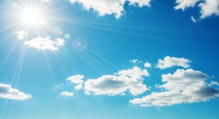 Bright Sun with Sunrays and Fluffy Clouds in a Blue Sky

