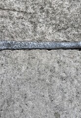 Top view of grey pavement with grouting