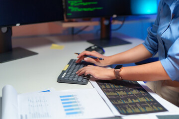 Two asian team working development of programming and encryption technology website design programmers on desk in office.