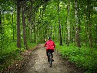 young woman riding a bicycle