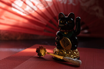 Traditional Chinese decor with lucky cat and red accents