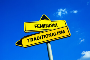 Feminism or Traditionalism - Yellow traffic sign with two options - choosing and deciding between feminist equality and traditional patriarchy and unequality and  unequal gender and sex roles.