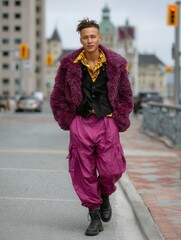 Fashion-forward young man walking on city street in vibrant streetwear and bold colors
