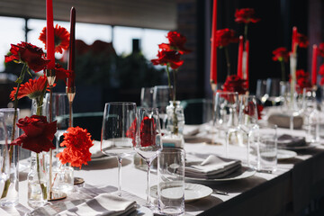 Elegant Table Setting with Red Flowers
