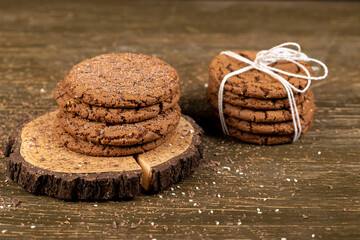 round chocolate biscuits with white sesame and cocoa powder, sweet chocolate-flavored biscuits with...
