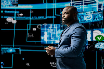 Portrait of a black professional engaged in coding and analytics, surrounded by AI neural networks...