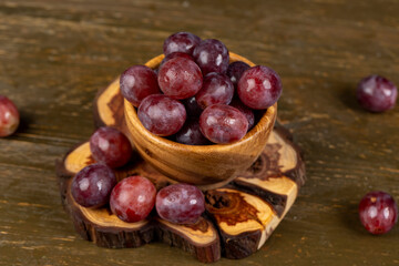 pink ripe grapes on the table after washing the berries