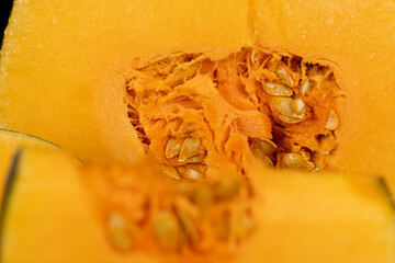 cut pumpkin for cooking, cut into pieces pumpkin in the kitchen, closeup