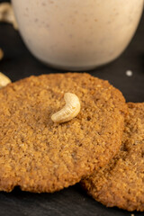 cookies and yogurt with prunes, a breakfast of oatmeal cookies and a glass of yogurt, close up