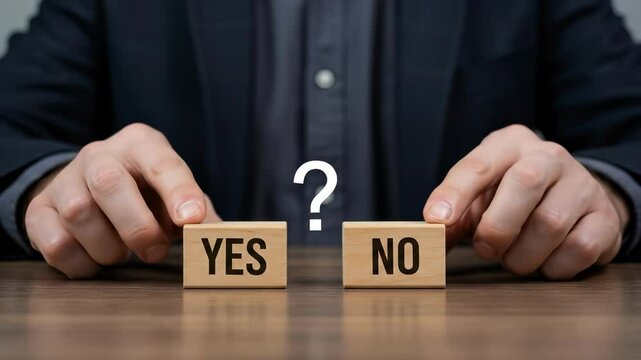 Yes or No? Decision Making Dilemma - Question Mark Blocks on Desk
