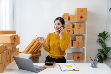 Asian Woman Managing Small Business from Home