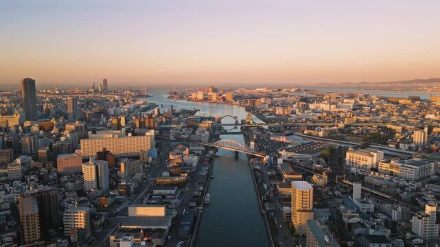 osaka city bay aerial view drone at sunrise,flying over ajigawa river industrial port area minato ward