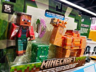 Naklejka premium Minecraft merchandise featuring collectible figures in toy store packaging