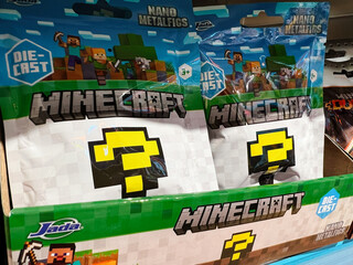 Naklejka premium Colorful Minecraft-themed surprise toy packages displayed on a store shelf