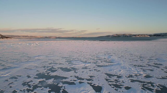 global warming frozen sea water melting inside bay aerial view drone
