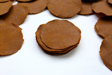 Fermented soybean discs, known as “Thua Nao,” a traditional Thai seasoning used to enhance flavor in Northern cuisine.