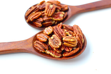 Delicious salted pecan nuts scattered.