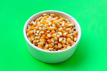 Yellow raw unpopped popcorn kernels