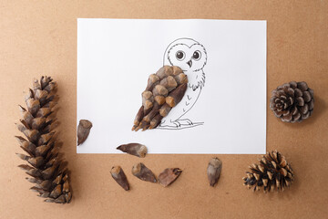 Whimsical forest owl figure from pine cone scales for children book illustrations, eco campaigns, educational kits, toy brands, homeschool materials and nature awareness visuals