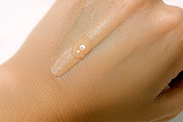 Fototapeta premium Light beige liquid foundation swatch on smooth surface