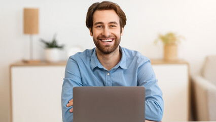Successful Businessman's Portrait. Happy Entrepreneur At Laptop Computer Smiling To Camera Sitting At Workplace In Modern Office. Freelance Career, Distance Work And Entrepreneurship Concept