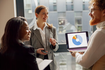 A dedicated professional team is actively collaborating and discussing valuable data insights...