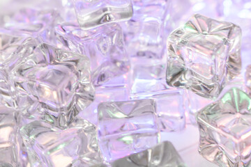 Close-Up of Transparent Ice Cubes with Iridescent Light Reflections – Abstract Frozen Texture...