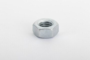 Stainless Hex Nut isolated on white background with bokeh