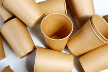 Brown paper cups on white background.