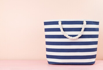 Blue beach bag on wooden table