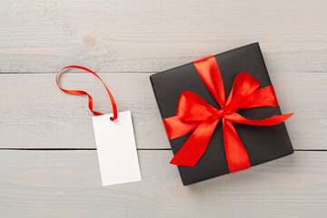 Black gift boxes on wooden background, top view. Black Friday concept