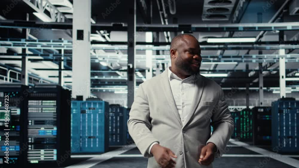 Poster manager walking in high tech data center facility with multiple rows of fully operational server rac